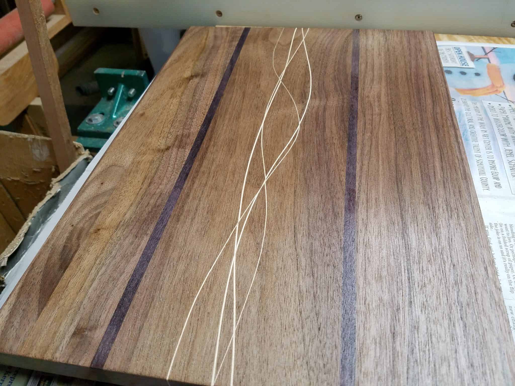 Maple strips bent into a glue up of walnut and purple heart